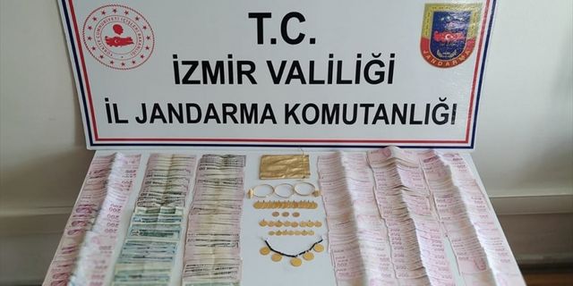 İzmir'de FETÖ bahanesiyle dolandırıcılık yaptığı iddia edilen 2 kişi yakalandı